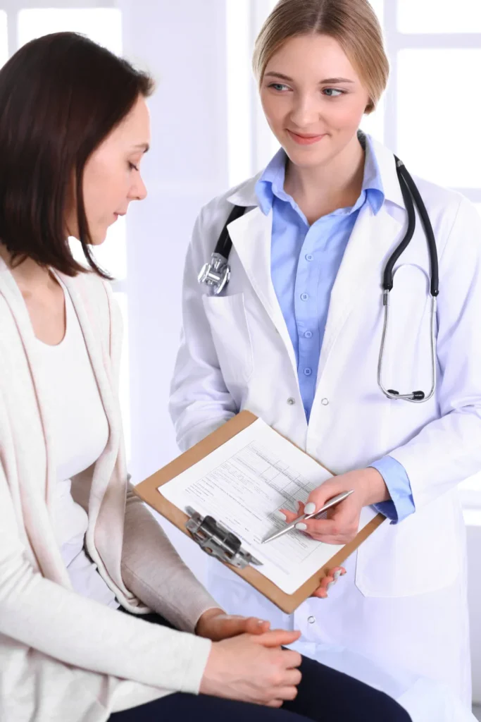 A Doctor Explaining Documents to a Patient