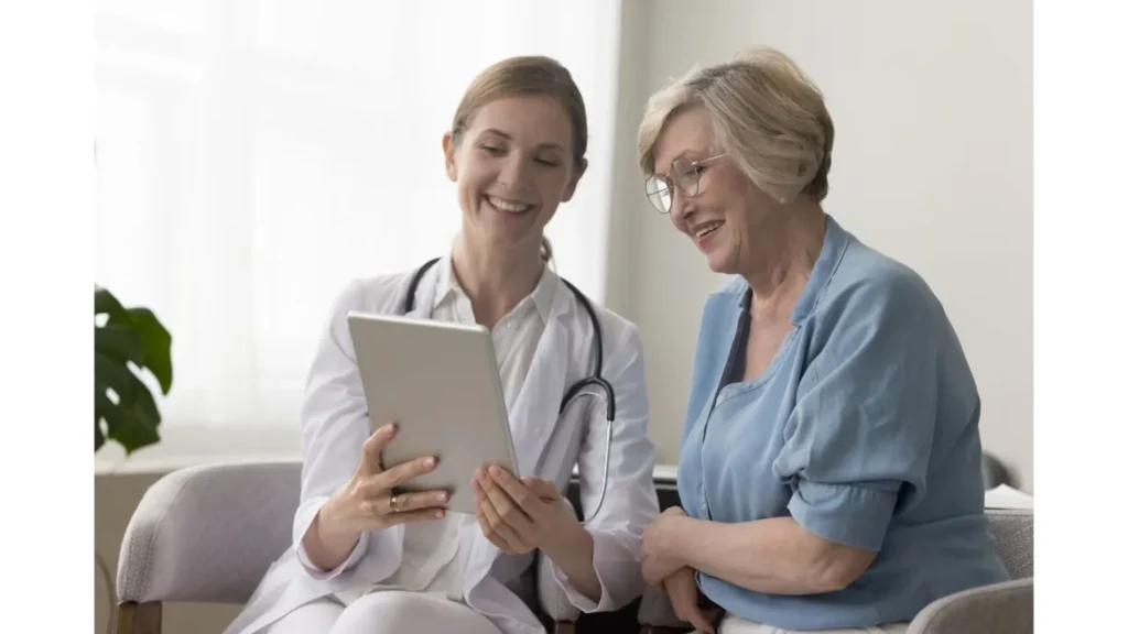 A Doctor Showing a Tablet to a Senior Patient