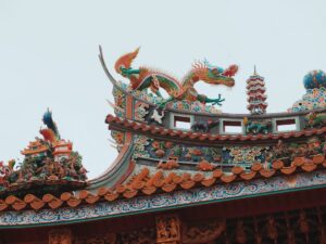 Ornate dragon sculptures on a temple roof