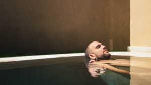 Man relaxing in a warm pool