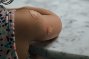 Adhesive bandage on a person's shoulder